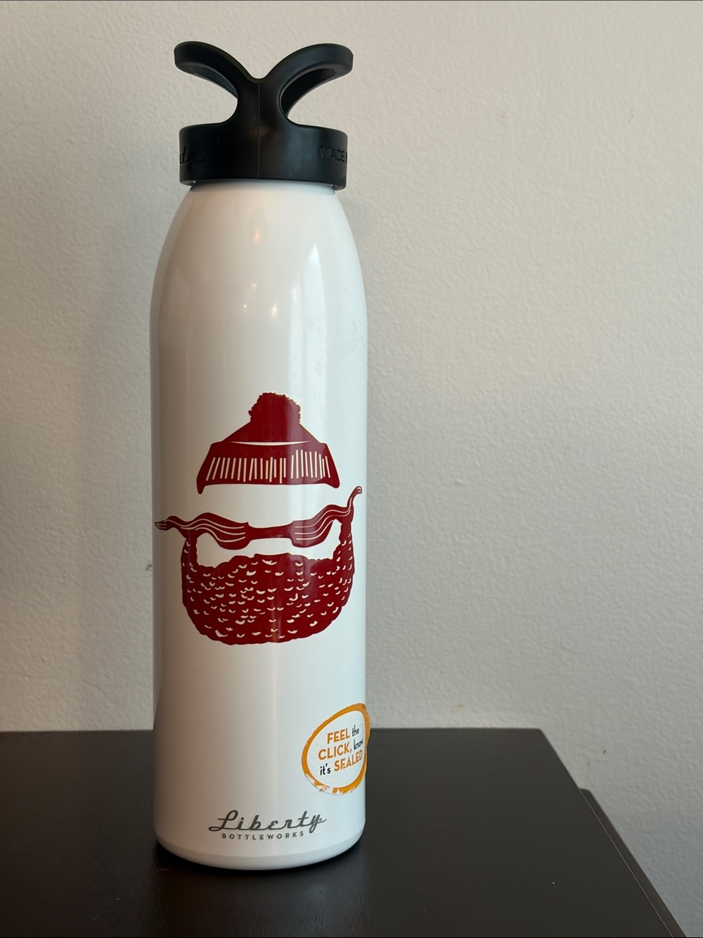 liberty White Bottle with Red Beard Graphic and Black Lid